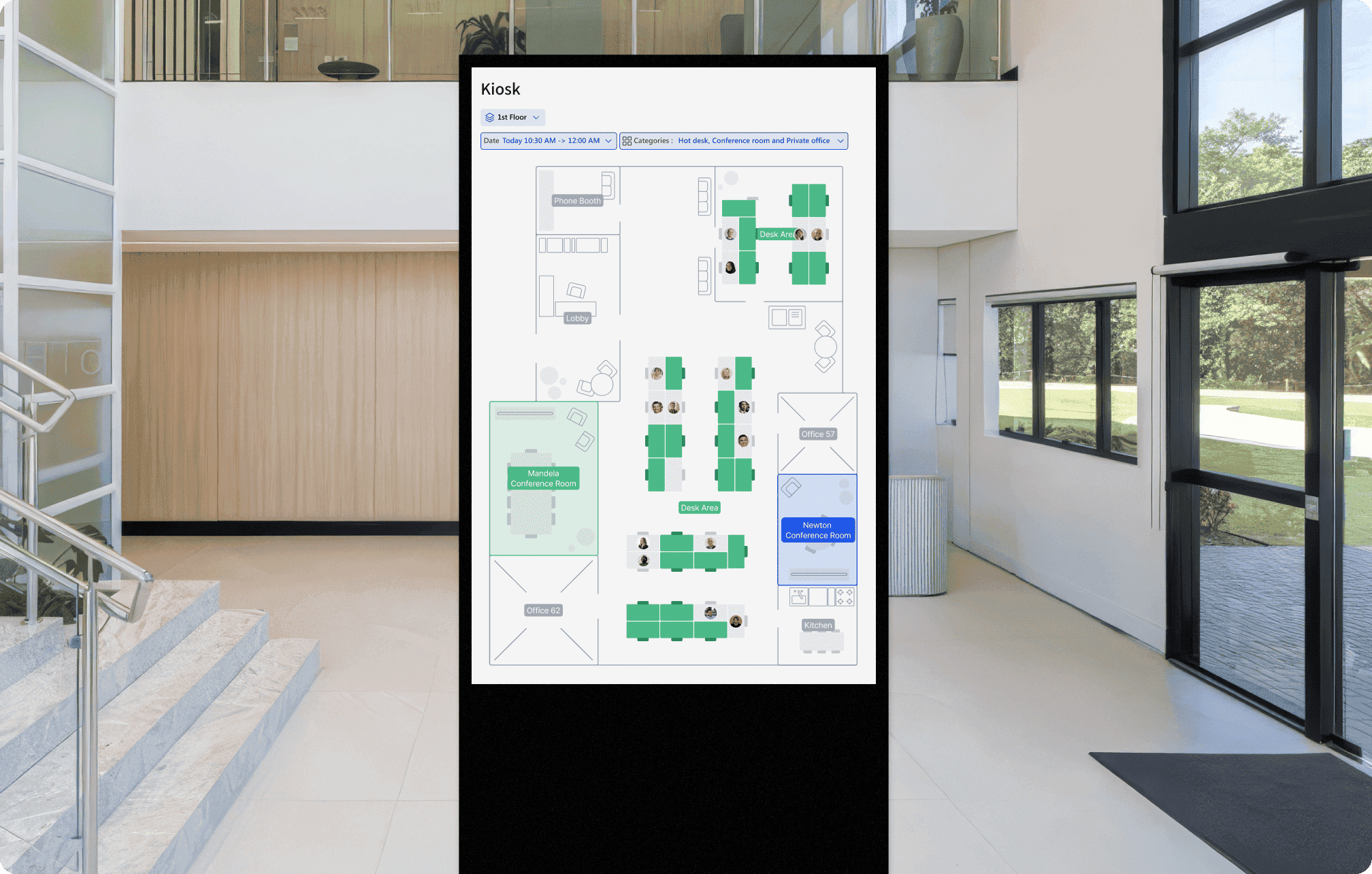 A digital kiosk displaying a floor map of an office building in Archie app, highlighting various areas such as phone booths, desk areas, conference rooms, and offices. The kiosk is situated in a modern office lobby.