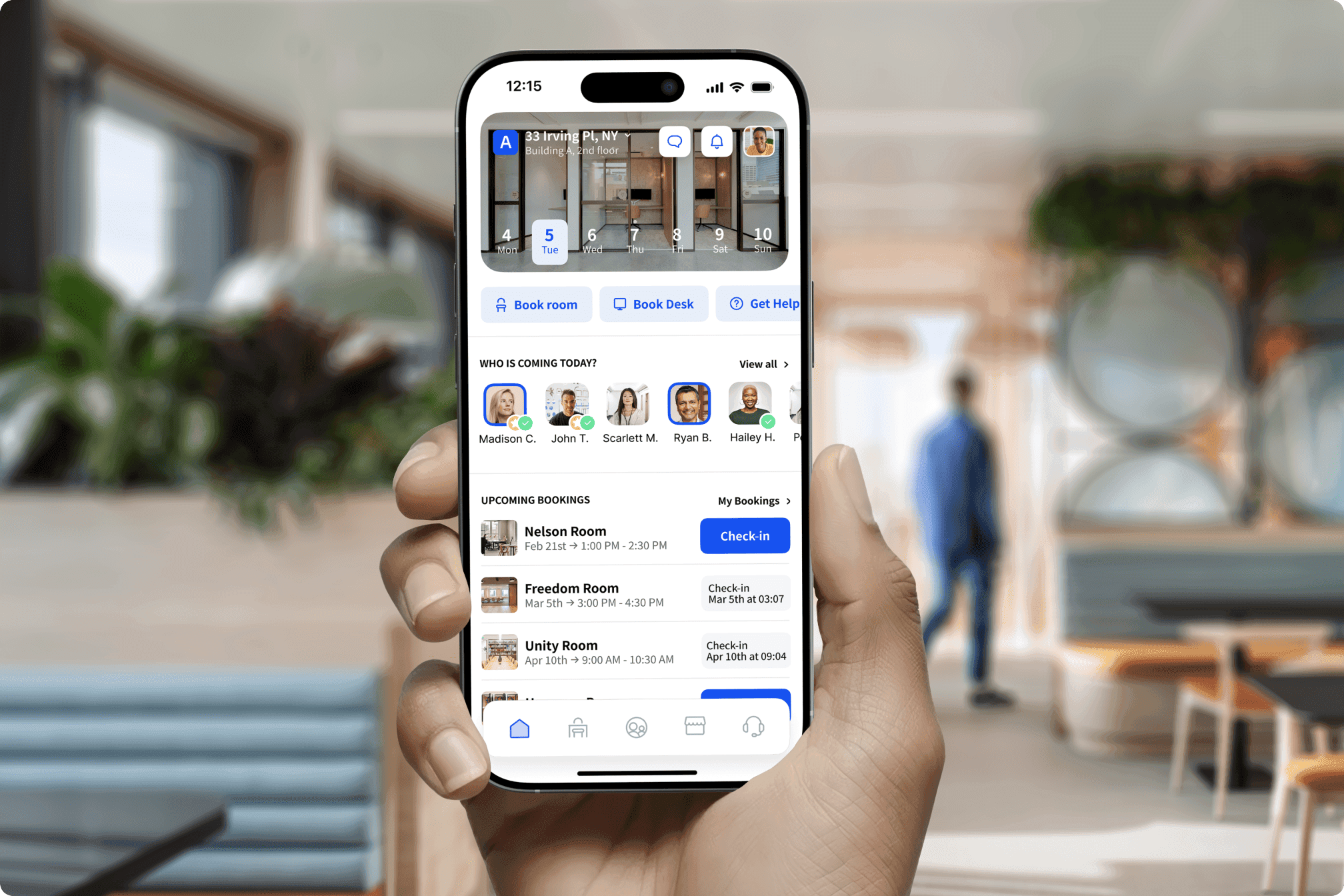 Hand holding a smartphone displaying Archie workspace booking app with upcoming bookings.