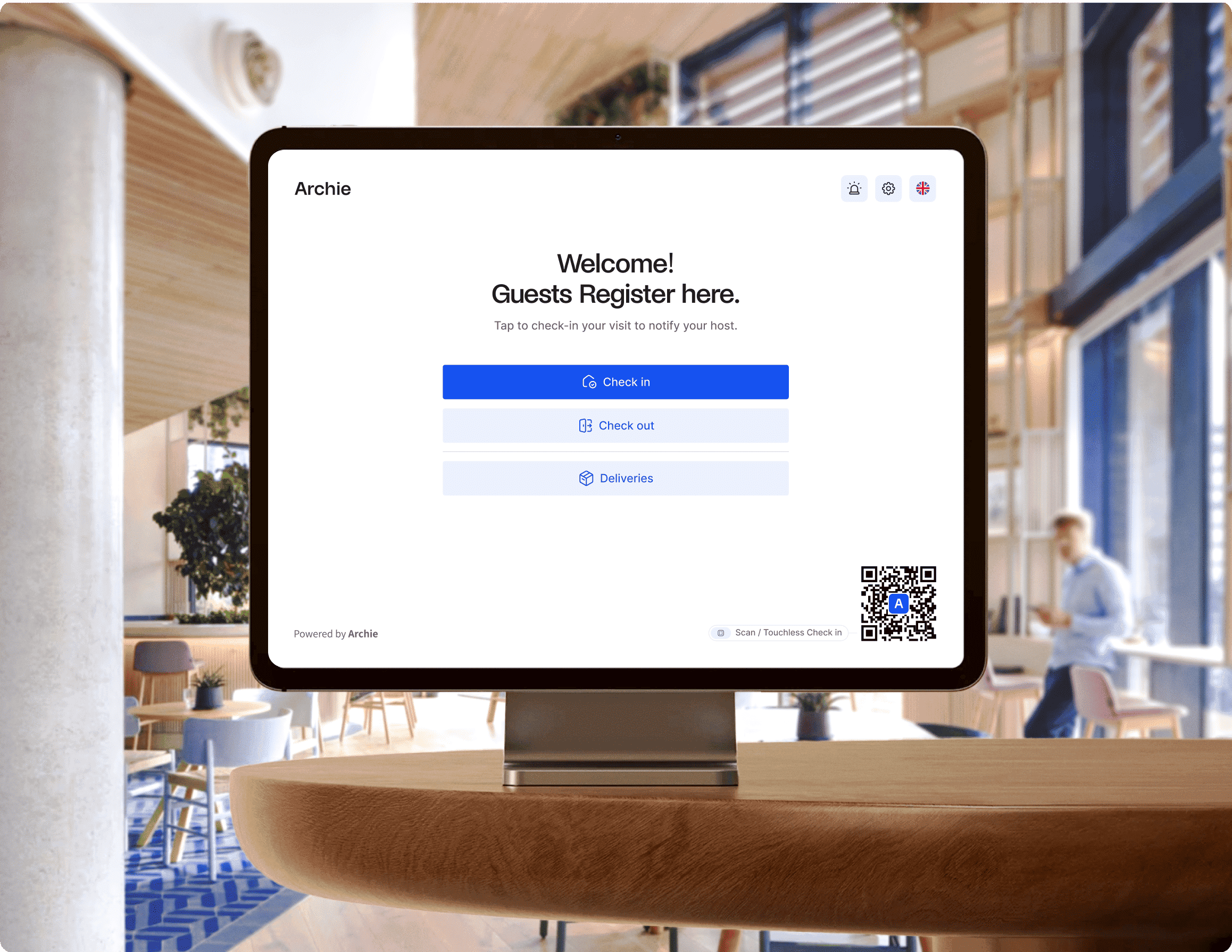 Check-in kiosk with Archie Visitors app showing options to check in, check out, or mark deliveries.