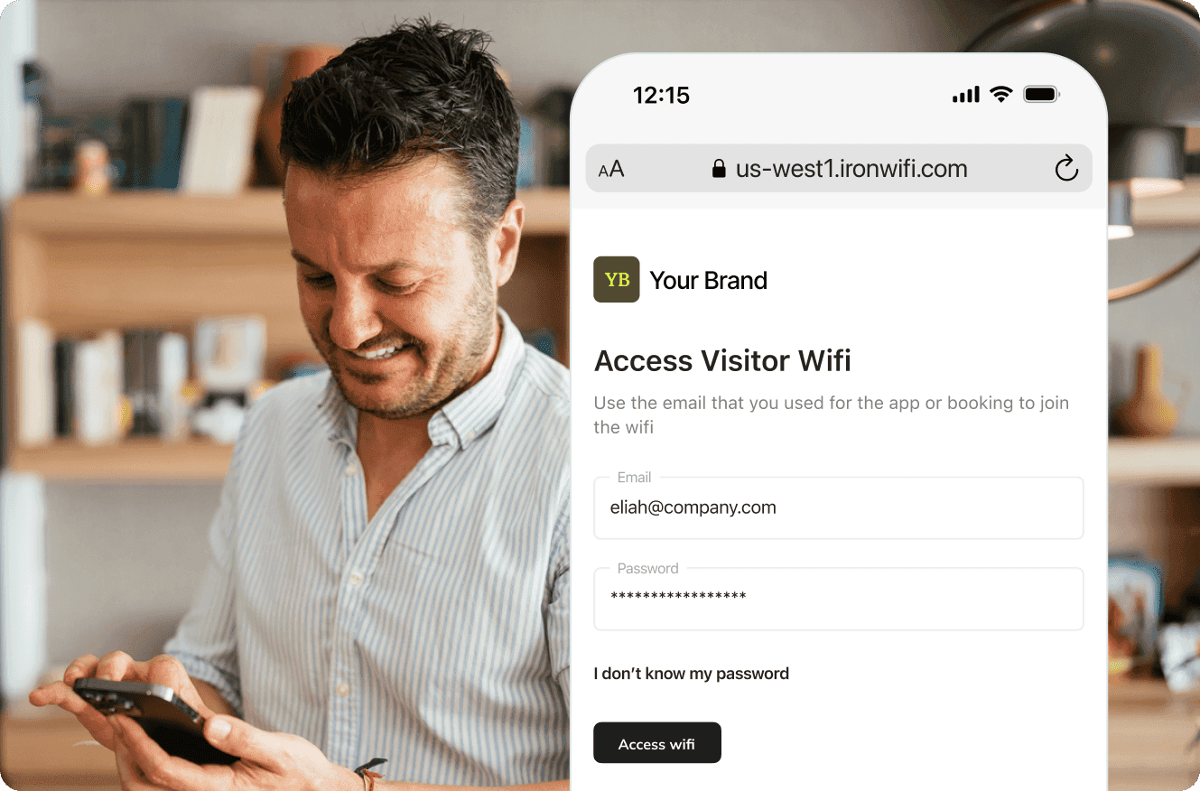 Person using a smartphone to access visitor WiFi with a login screen displayed.